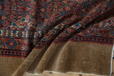 Vintage Serab runner's folded back, revealing camel-colored foundation and secure woven edge.