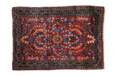 Vintage American Sarouk square rug, cherry red, allover floral sprays, indigo border.