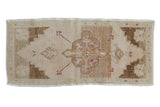 Vintage distressed Oushak rug mat runner with scalloped geometric floral medallion and purple blossoms, 1'6