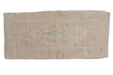 Distressed Oushak rug runner in soft beige with gentle seafoam green quatrefoil motifs, 1'10