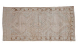 Distressed Oushak runner with faded cream and coffee bronze geometric medallion, 2'9