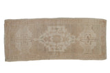 Vintage Distressed Oushak runner with faded beige, sand, and ivory floral medallion, 1'7