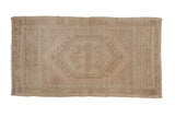 Vintage distressed Turkish Oushak rug, faint hexagonal medallion, muted beige tones, 1'8
