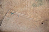 Distressed Oushak rug reverse showing painted numbers and intact side cord selvage.