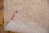 The hand-knotted foundation and original side cord of a distressed Turkish Oushak runner.