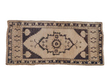 Vintage distressed Oushak runner, ivory and dusty dark blue charcoal floral medallion, 1'10