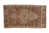 Distressed Oushak rug, stepped medallion, floral blossoms, heavily abrashed ground, 1'11