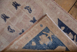 Vintage Distressed Oushak rug showing hand-knotted reverse, intact selvages, and worn pile.