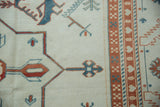 Evenly worn pile on a Turkish Oushak carpet showing rust and powder blue geometric relief.