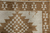 Close-up of the vintage Kars rug's hand-knotted texture and serrated geometric patterns.