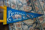 Yellow stitched band and blue felt of the vintage Buffalo NY pennant.