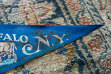 Vintage Buffalo NY felt flag, 'N.Y.' letters with dark markings on blue felt.