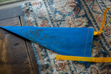 Vintage Buffalo NY felt pennant flag's pointed end with visible dark staining.