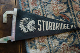 Angled view of the vintage Sturbridge felt pennant with its Native American chief graphic.