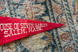 Close-up of the white printed text on the vintage red felt Salem, Mass. pennant.