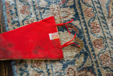 Vintage red felt pennant, close-up of 'M.S. PRODUCTS Made in Japan' label and red ties.