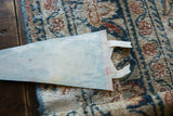 Reverse side of the vintage felt flag showing its texture and streamers.