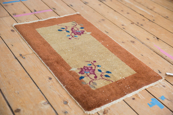 Vintage Nichols Art Deco rug mat with floral vinery shown from a high angle, measuring 1'6