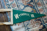White 'WYTHEVILLE, VA.' lettering on vintage teal felt pennant.