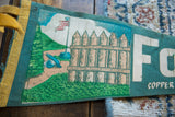 Illustrated graphic on a Fort Wilkins felt pennant showing the historic cannon and wooden fence.