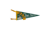 Vintage 1958 Old Fort Niagara felt flag in green and yellow with Blockhouse Entrance graphic.