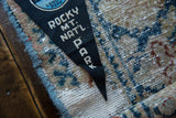 Vintage black felt pennant with visible creases and white Rocky MT. NAT'L. PARK text.