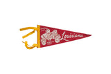Mid-century red felt Louisiana pennant with white magnolia flower graphic and yellow ties, 5x11.