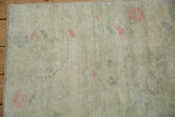 Even wear to the knot heads showing faint foundation on a distressed vintage Oushak rug.