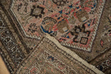 Vintage Hamadan rug corner revealing hand-knotted back foundation and short pile.