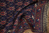 Intricate detail of the original end kilim weave and fringe on an antique Persian Afshar rug.