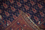 The intricate original kilim end weave and fringe of a hand-knotted antique Afshar rug.