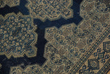 Antique Senneh rug's scalloped navy contour, intricate Herati pattern, and foundation wear.
