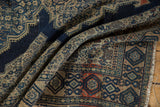 Antique Persian Senneh rug detail: intricate Herati pattern, navy blue, beige, and terracotta shades.