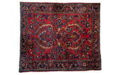 Vintage Lilihan Persian rug, rich cherry red field, double floral bouquet, navy border.