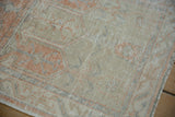 Detailed view of the distressed pile revealing the knot heads and geometric patterns of the vintage Oushak.