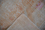 Vintage Distressed Oushak rug showing worn pile, exposed foundation, and reverse's painted numbers.