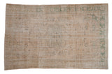 Distressed hand-knotted Oushak rug with faded cream, sage green medallion, allover botanicals, 6x9.