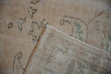 Textured distressed pile with abrashes, fringe, and reverse of vintage Oushak rug.
