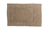 Distressed vintage Oushak rug mat, subtle serrated medallion, abrashed beige and cream.