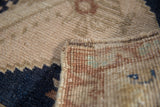 Vintage Distressed Oushak rug with original intact side cord selvage, coppery beige.