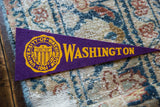 Vintage purple felt University of Washington flag, yellow text, and school crest detail.