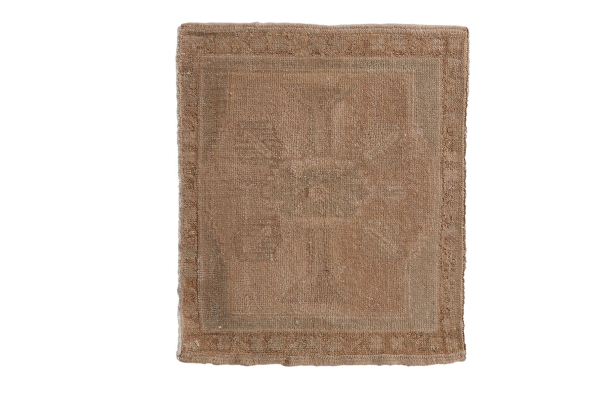 Vintage distressed Oushak square rug mat with a faded floral medallion over an abrashed beige field.