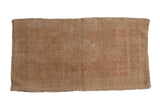 Vintage distressed Oushak rug with faded medallion, corner spandrels, and soft beige tones.