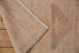 Hand-knotted backing of the distressed Oushak rug, revealing its woven foundation and intact selvage.