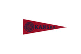 Red vintage University of Kansas felt pennant with navy blue school crest and text.