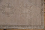 Evenly worn pile and intact side cord selvage on a vintage distressed Oushak rug.