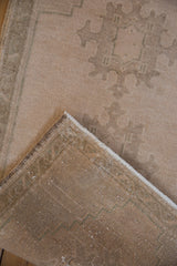 View of the hand-knotted foundation and original side cord selvage on a Turkish Oushak rug.
