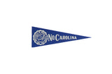 Vintage University of North Carolina blue felt pennant with white school crest and lettering.