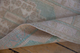 Vintage Oushak rug's distressed pile with even wear, revealing its hand-knotted foundation.