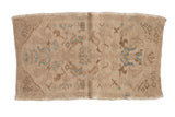 Distressed vintage Oushak rug mat with faded beige, turquoise, and brown floral patterns, 1'9